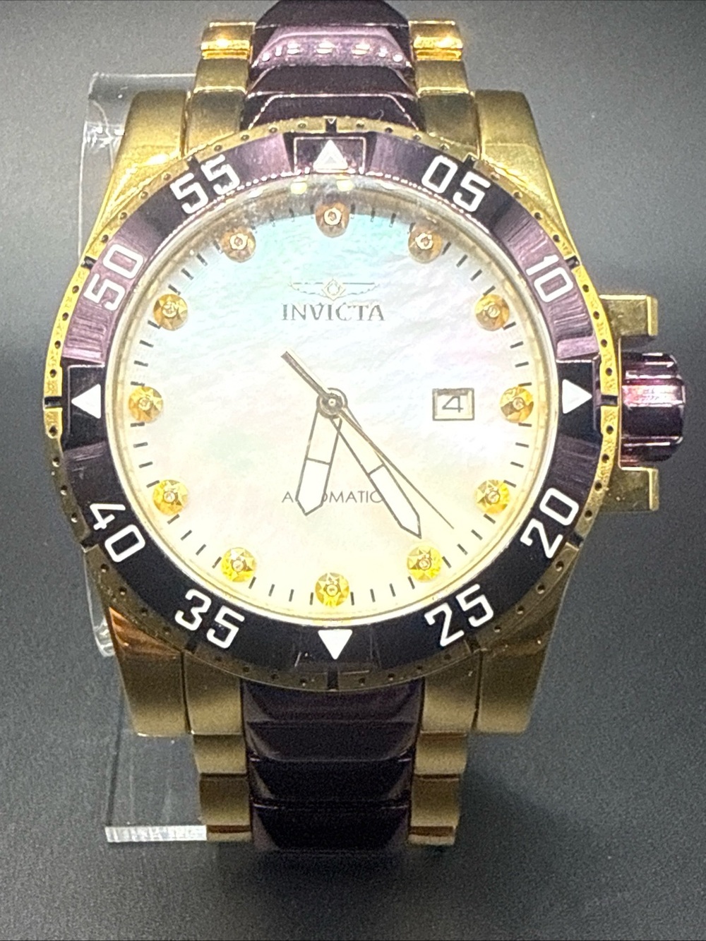 Invicta Excursion model 33349 MOP Dial Purple Gold Tone